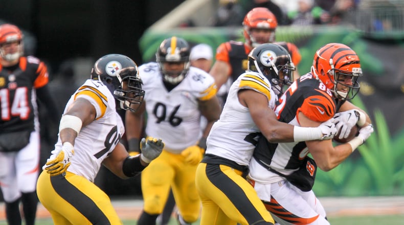 Bengals tight end Tyler Eifert (85) makes a catch over the middle during their game against the Steelers at Paul Brown Stadium, Sunday, Dec. 18, 2016. GREG LYNCH / STAFF