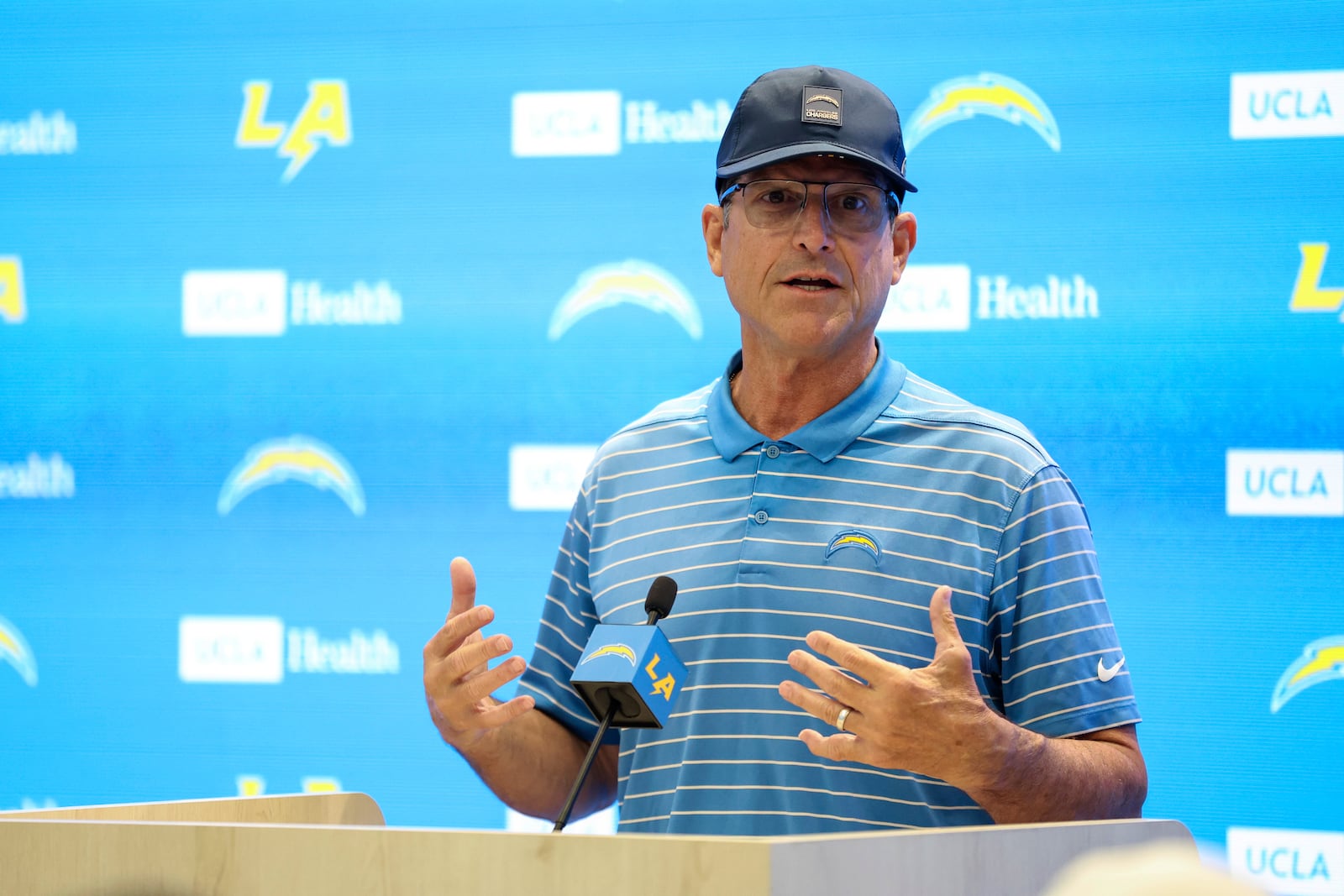 Los Angeles Chargers head coach Jim Harbaugh speaks during a press conference during training camp for the NFL football team Thursday, July 17, 2025, in El Segundo, Calif. (AP Photo/Eric Thayer)