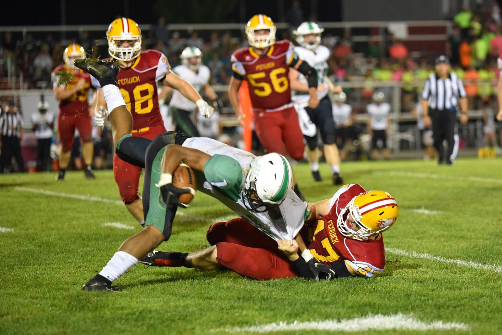 Fenwick’s Ben Gustely brings down Badin’s Davon Starks during Friday night’s game at Krusling Field in Middletown. The host Falcons won 21-9. CONTRIBUTED PHOTO BY ANGIE MOHRHAUS