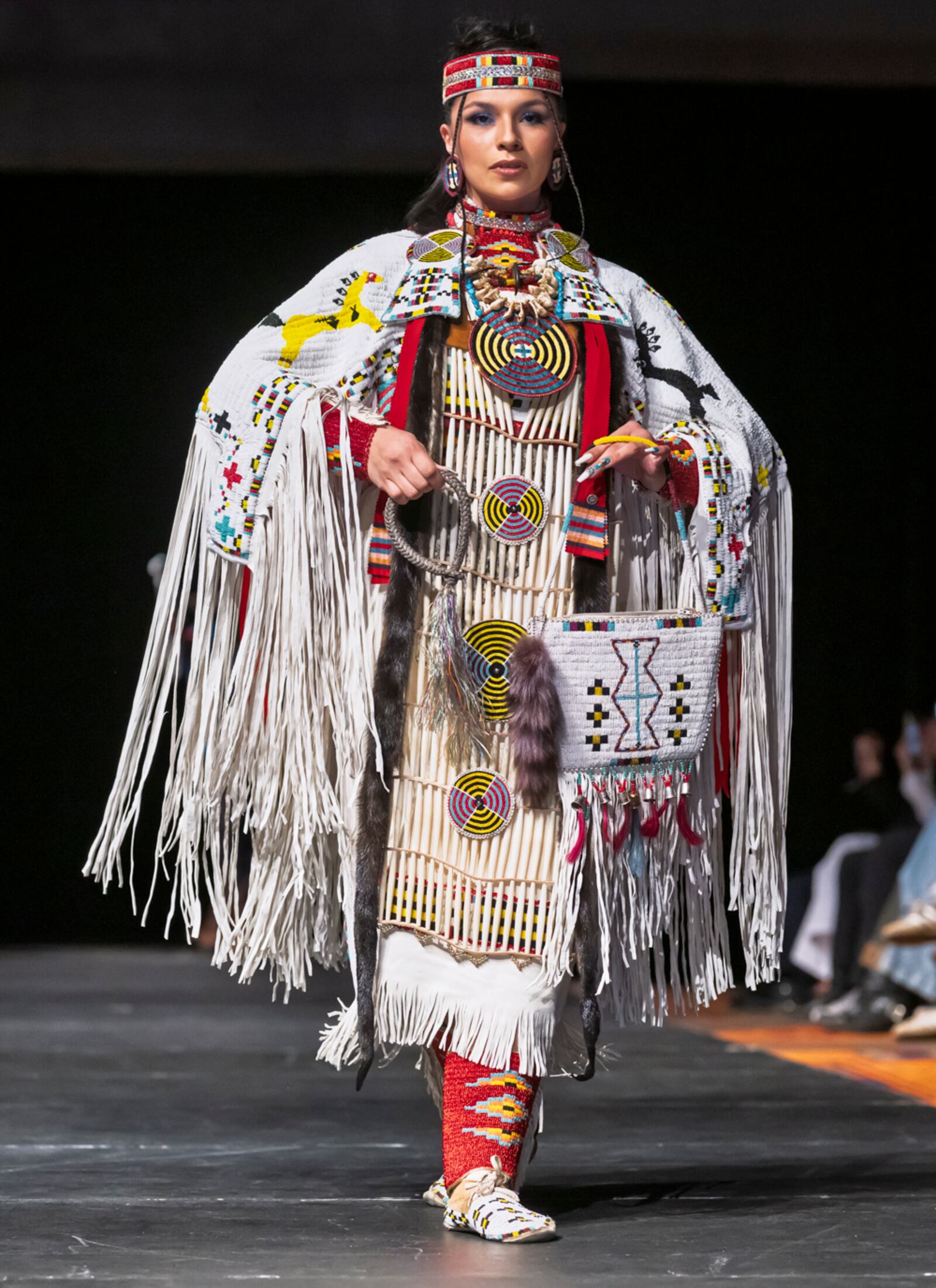 A model wears a design by Livia Manywounds on the runway at the 2025 Native Fashion Show, Friday, May 9, 2025, in Santa Fe, N.M. (AP Photo/Roberto E. Rosales)