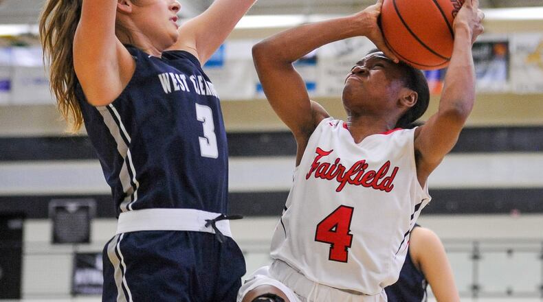 Fairfield’s Zahrya Bailey goes to the basket defended by West Clermont’s Gracie Haywood during their Division I sectional game Wednesday night at Lakota East. West Clermont won 61-56 in overtime. NICK GRAHAM/STAFF