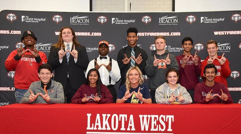 Twelve Lakota West High School student-athletes were included in a Signing Day ceremony at the school last winter. The top row (left to right) includes David Walcott (football, Ball State), Brian Qua (football, Grand Valley State), Zelwyn Robinson (football, Georgetown), Payton Porterfield (football, Hocking College), Brandon Whited (soccer, Heidelberg), Jeffrey Douyere (soccer, Earlham) and Andrew Brengelman (soccer, Malone). The front row (left to right) includes Will Nguyen (football, Georgetown), Jennifer Douyere (soccer, Earlham), Caley Murphy (soccer, Mount St. Joseph), Devin Duhme (soccer, Lander) and Jeremy Douyere (soccer, Earlham). SUBMITTED PHOTO