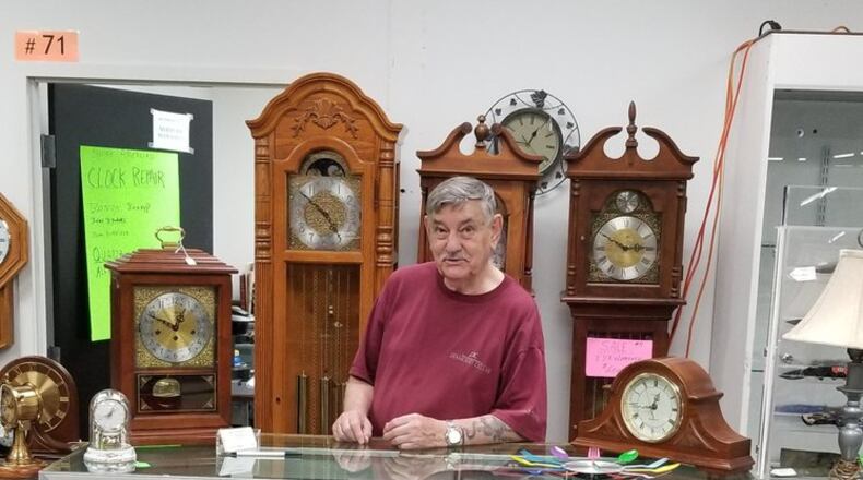 Chuck McKinney takes his refurbished clocks to Springboro Flea Market in Franklin, Ohio, after selling his long-time repair business due to necessity.