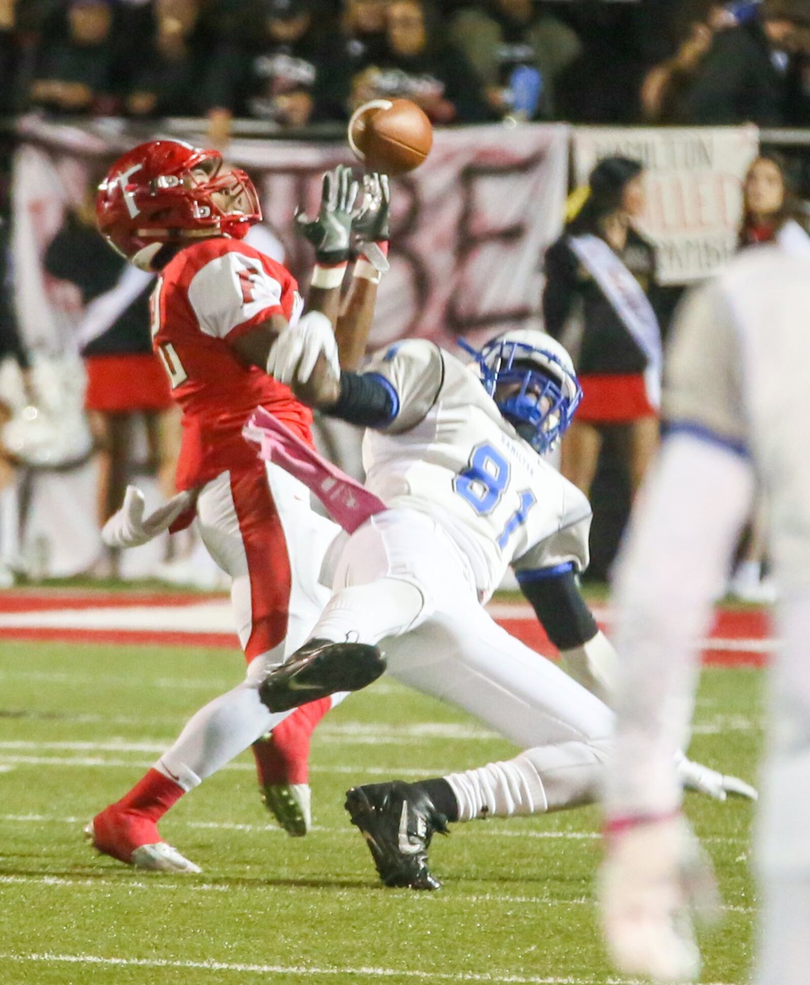 Fairfield defensive back Josiah Scott (22) and Hamilton wide receiver Daevon Williams (81) battle over a deep pass that fell incomplete during their game at Fairfield Stadium on Oct. 28, 2016. GREG LYNCH/STAFF