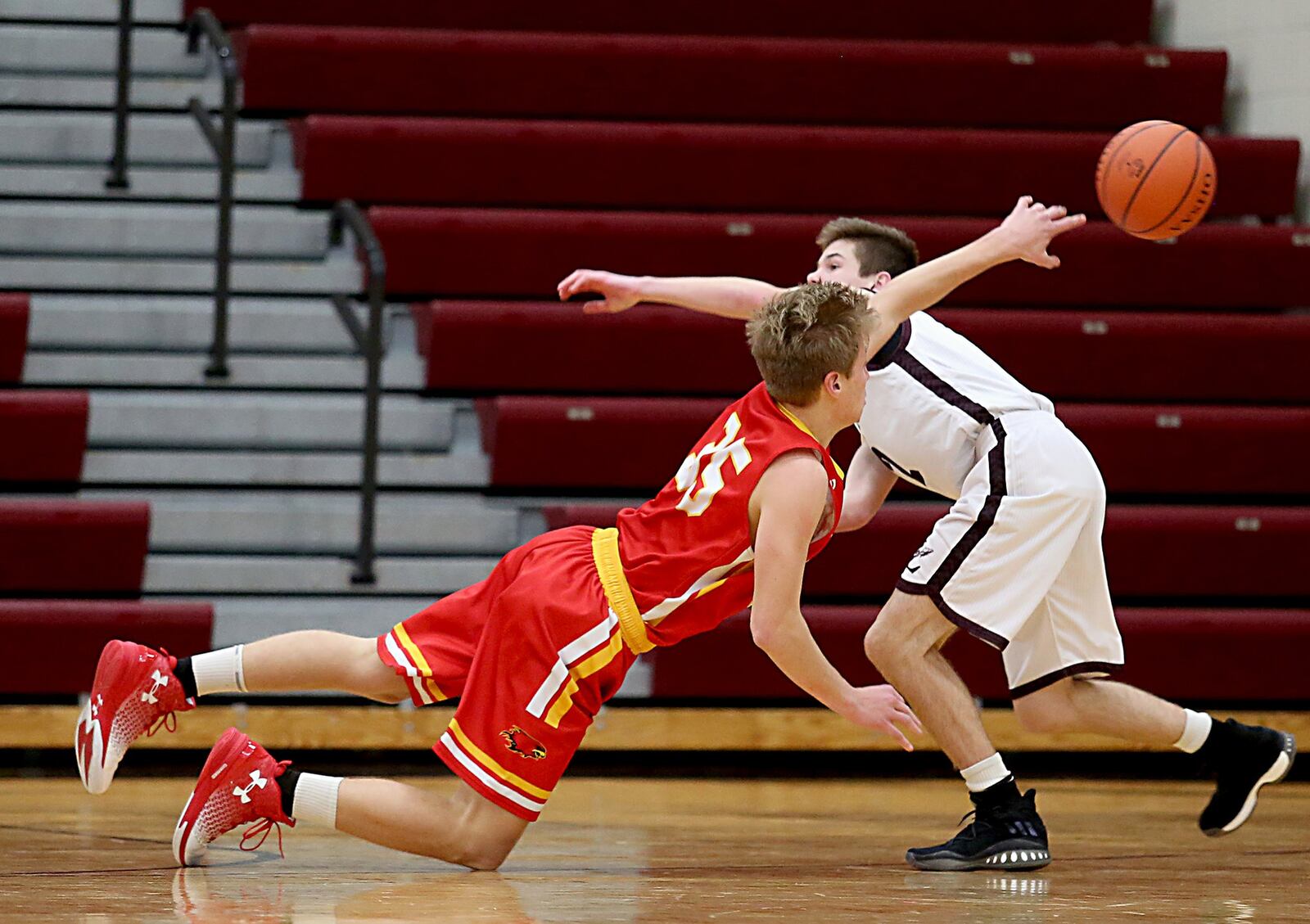 Fenwick forward Luke Bradshaw gets off a pass as Lebanon guard Sammy Stotts pressures during their game at Lebanon on Saturday night. CONTRIBUTED PHOTO BY E.L. HUBBARD