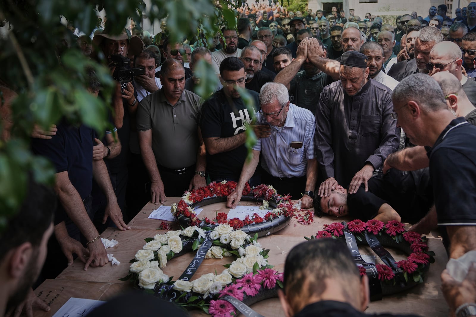 Relatives attend the funeral of four members of the Khatib family, Palestinian citizens of Israel killed in an Iranian missile strike on Tamra, Israel, on Tuesday, June 17, 2025. (AP Photo/Mahmoud Illean)