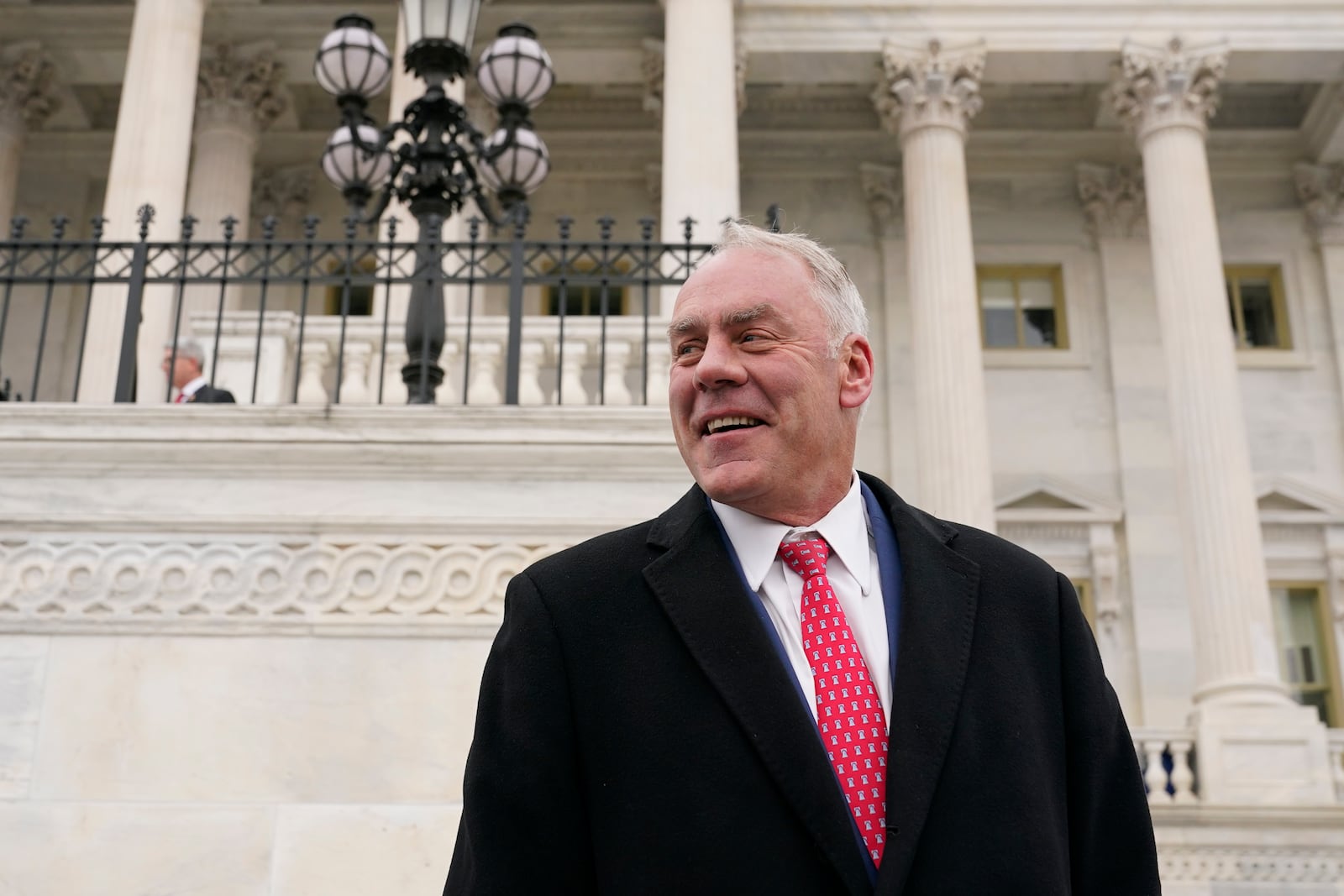 FILE - Then Rep.-elect Ryan Zinke, R-Mont., stands on the East Front of the Capitol after participating in a class photo of newly-elected members of Congress, Nov. 15, 2022, in Washington. (AP Photo/Patrick Semansky, File)