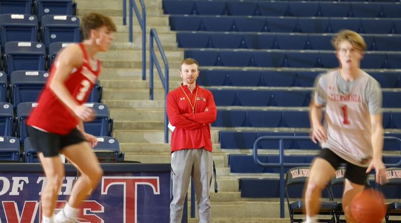 New varsity coach Connor Roberts is one of the youngest head basketball coaches in the area. Roberts, a 2014 graduate from Talawanda, now teaches and coaches where he played basketball in high school. NICK GRAHAM/STAFF