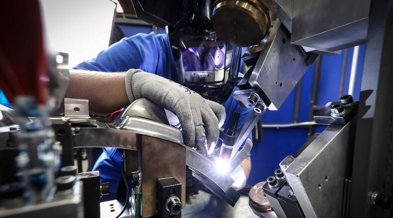 An aerospace welder at work at GE Aviation/Unison in Beavercreek. Contributed
