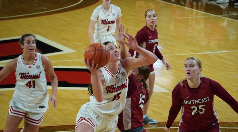 Miami's Amber Tretter goes up for a shot against Indiana-Southeast on Thursday afternoon at Millett Hall. CHRIS VOGT / CONTRIBUTED