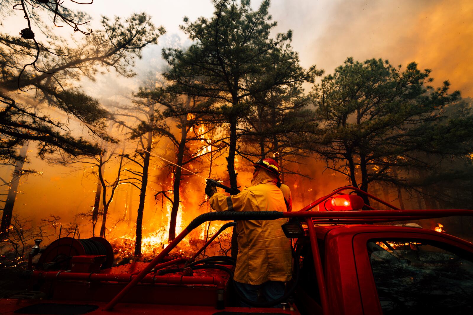 Firefighters battle a wildfire in Ocean County, N.J. on Thursday, April 24, 2025. (New Jersey Department of Environmental Protection via AP)