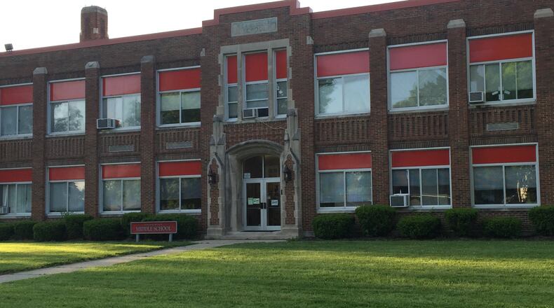 The Carlisle Board of Education on Monday approved the first of two steps to place a nearly $49 million bond issue to build a new school building. Chamberlain Middle School, which was built in 1930, would be one of four buildings that would be demolished and replaced with a new K-12 building. ED RICHTER/STAFF