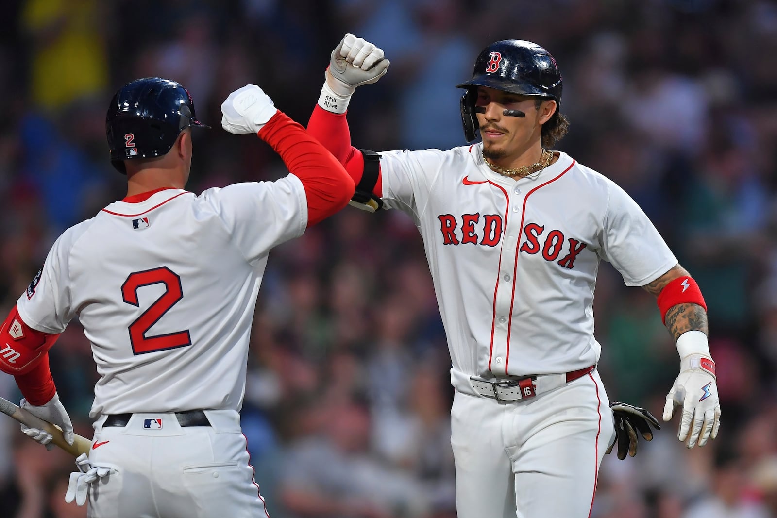Boston Red Sox's Jarren Duran, right, celebrates after his two-run home run with Alex Bregman, left, in the third inning of a baseball game against the Atlanta Braves, Saturday, May 17, 2025, in Boston. (AP Photo/Steven Senne)