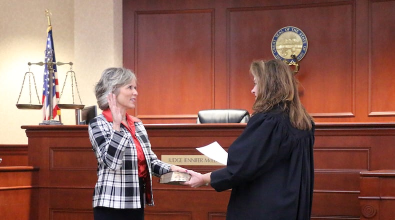 Butler County Common Pleas Court Judge Jennifer Muench-McElfresh swears in new County Auditor Nancy Nix on Feb. 13, 2023