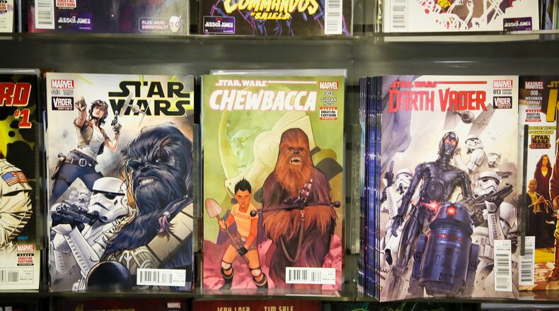 The popular Star Wars comics on display at Queen City Comics Fairfield, Thursday, Dec. 10, 2015. GREG LYNCH / STAFF