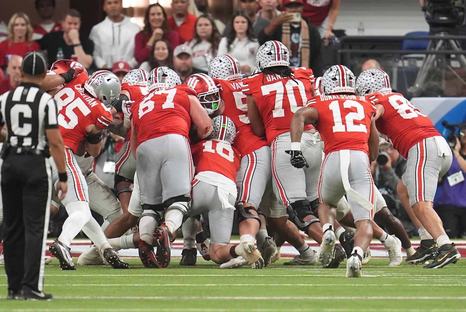Ohio State's Julian Sayin is stopped on a fourth down run during the second half of the Big Ten championship NCAA college football game against Indiana in Indianapolis, Saturday, Dec. 6, 2025. (AP Photo/Michael Conroy)