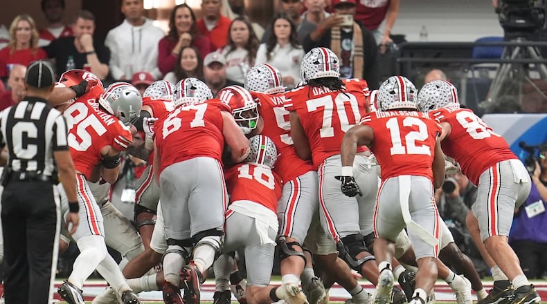 Ohio State's Julian Sayin is stopped on a fourth down run during the second half of the Big Ten championship NCAA college football game against Indiana in Indianapolis, Saturday, Dec. 6, 2025. (AP Photo/Michael Conroy)