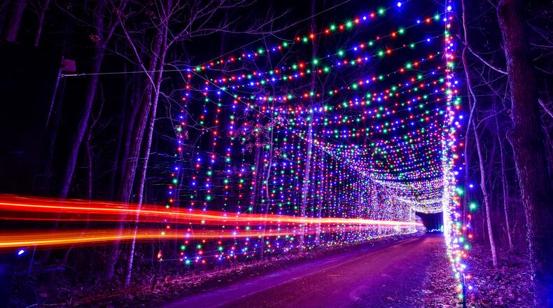 The Land of Illusion Christmas Glow on Thomas Road in Madison Township is open nightly through December with over 3.5 million lights in a 1.5 mile drive-through light display.  This is one of several light tunnels on the path. NICK GRAHAM/STAFF