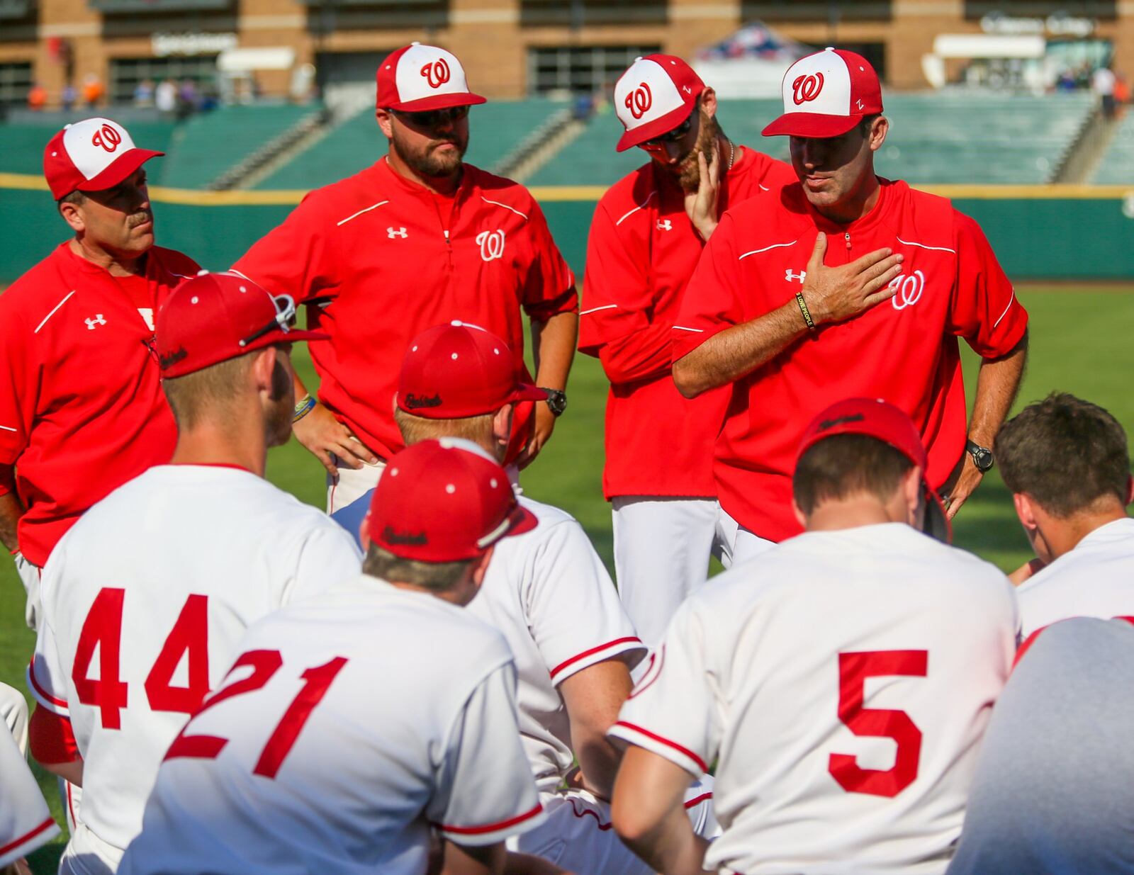 Lakota West coach Greg Leurck talks to his team after Friday’s 5-1 loss to Massillon Jackson in a Division I state semifinal at Huntington Park in Columbus. GREG LYNCH/STAFF