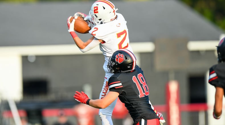 Fenwick's Jackson Kauffman (2) makes the catch in front of Franklin's Tucker Campbell (18) during their season opener on Friday night at Franklin's Atrium Stadium. Kyle Hendrix/CONTRIBUTED