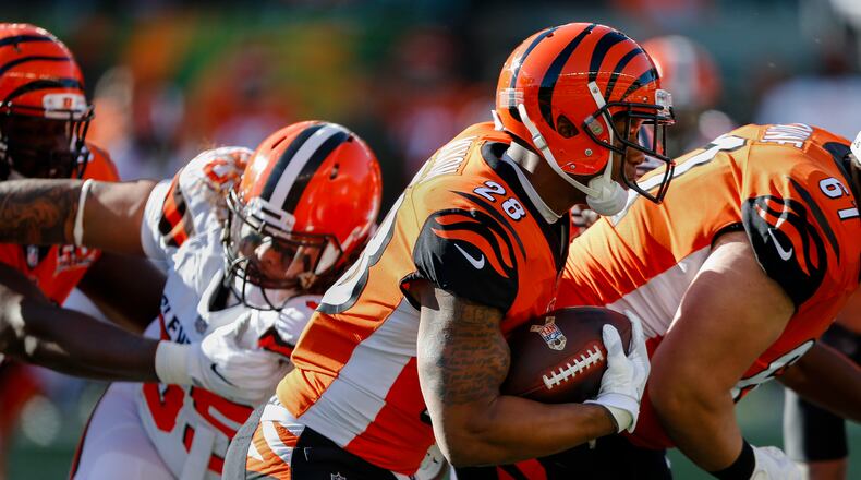 Cincinnati Bengals running back Joe Mixon (28) runs the ball in the first half of an NFL football game against the Cleveland Browns, Sunday, Nov. 26, 2017, in Cincinnati. (AP Photo/Gary Landers)