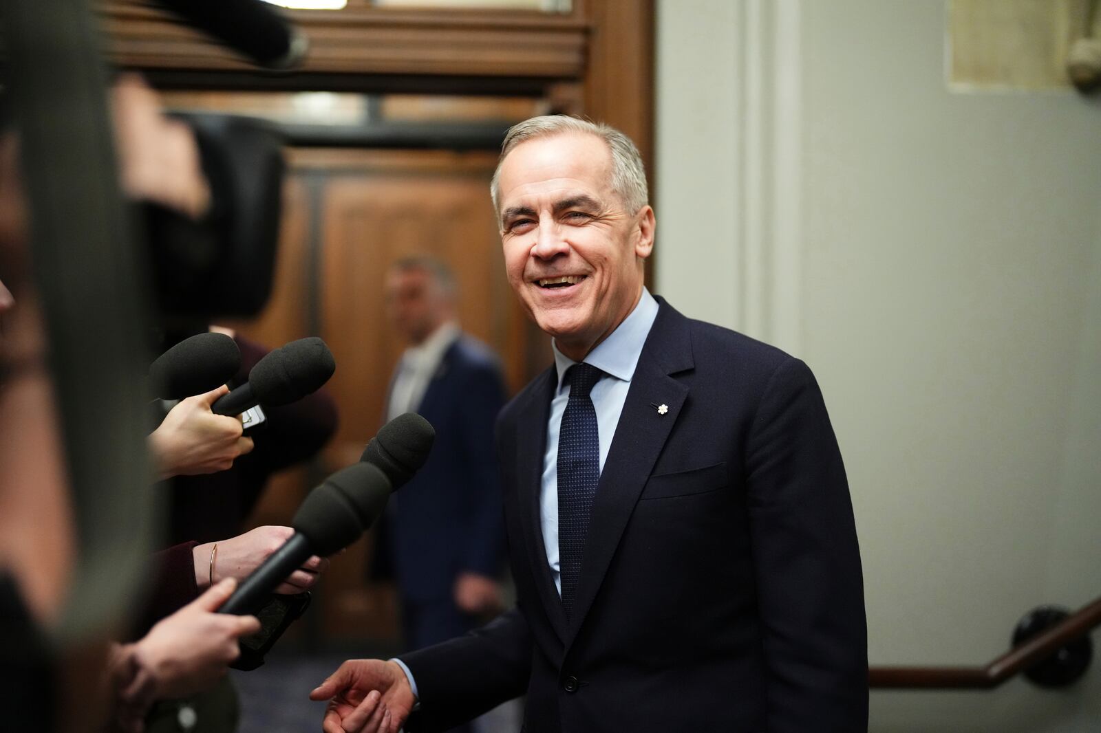FILE - Canada Liberal Leader Mark Carney talks to the media as he leaves the prime minister's office and makes his way to a caucus meeting in Ottawa on March 10, 2025. (Sean Kilpatrick/The Canadian Press via AP, File)