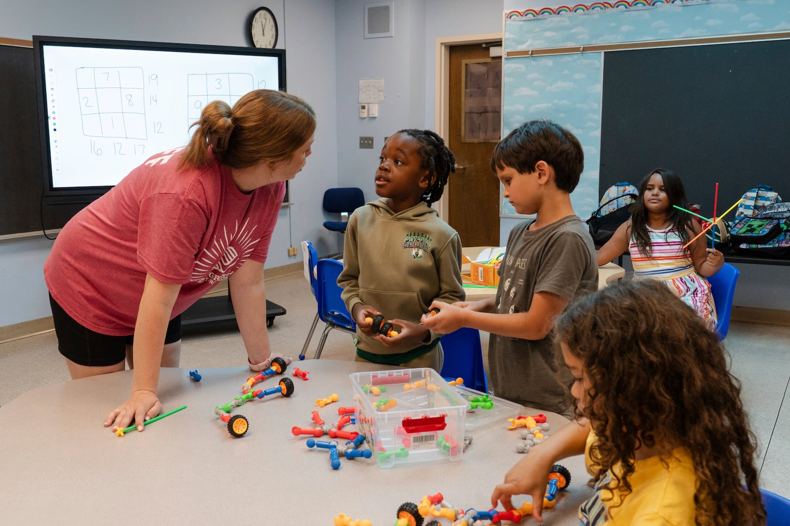 Children play with building blocks before participating in math activities during the East Providence Boys and Girls Club Summer Camp at Emma G. Whiteknact Elementary School on Thursday, July 10, 2025, in Providence R.I. (AP Photo/Sophie Park)
