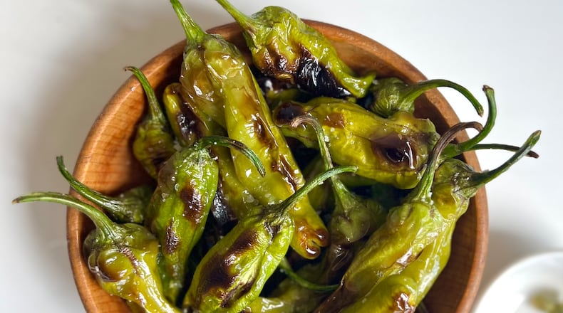 Blistering Shishito Peppers require simple preparation and take exactly 8 minutes, you hardly need a recipe, and they accommodate nearly every dietary restriction. WHITNEY KLING/CONTRIBUTED