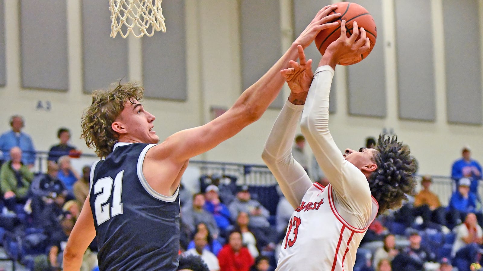 La Lumiere's Rivers Knight blocks a shot by Roman Combs during Lakota West's 72-71 overtime loss to La Lumiere on Sunday at Flyin' To The Hoop at Fairmont High School's Trent Arena. Jeff Gilbert/CONTRIBUTED