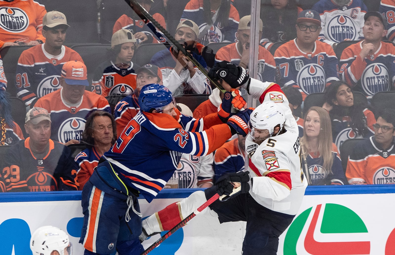 Florida Panthers' Aaron Ekblad (5) is checked by Edmonton Oilers' Leon Draisaitl (29) during the third period in Game 5 of the NHL hockey Stanley Cup Final in Edmonton, Alberta, Saturday, June 14, 2025. ( Jason Franson/The Canadian Press via AP)