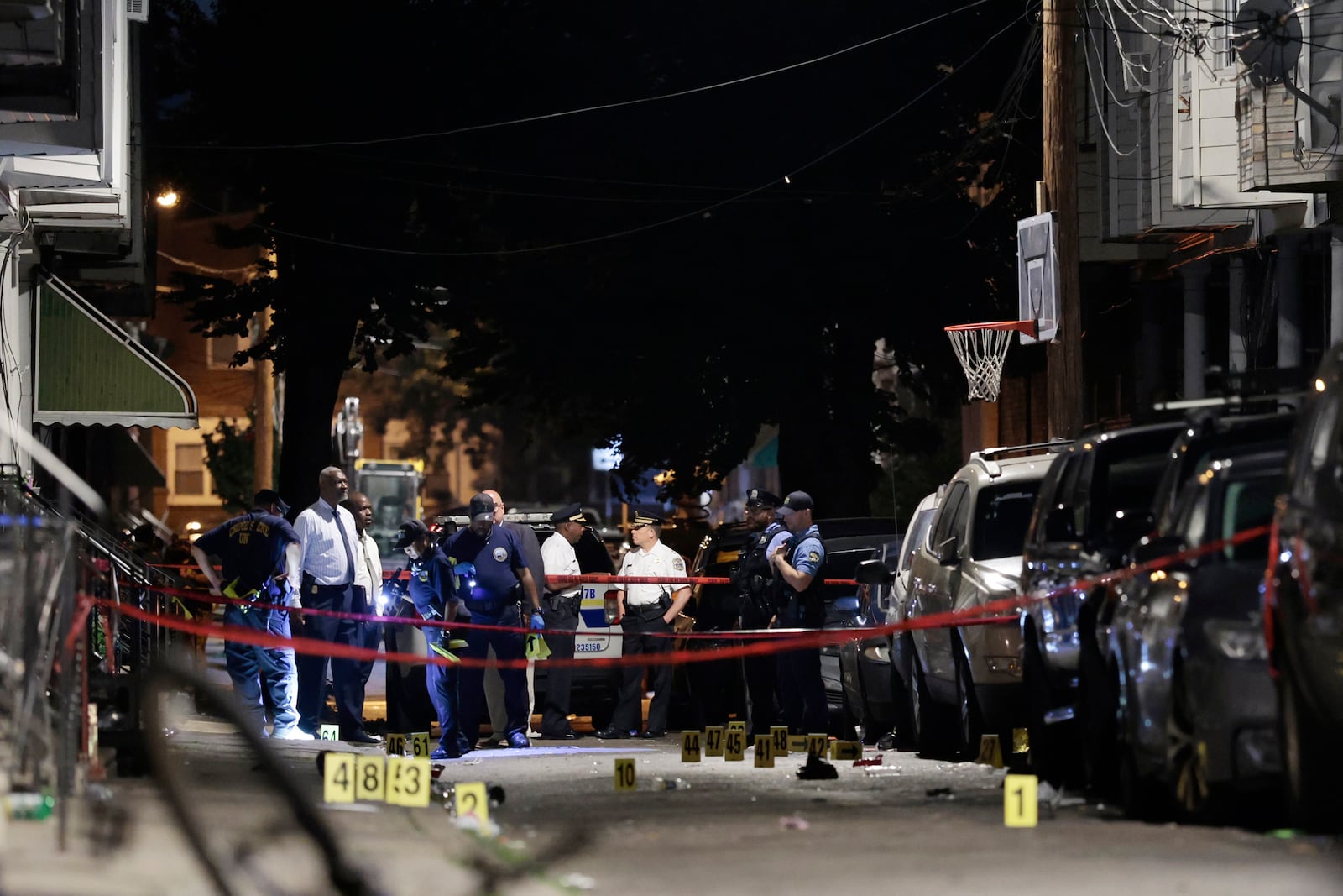 Police investigate the scene of an overnight shooting in Philadelphia, Monday, July 7, 2025. (Alejandro A. Alvarez/The Philadelphia Inquirer via AP)