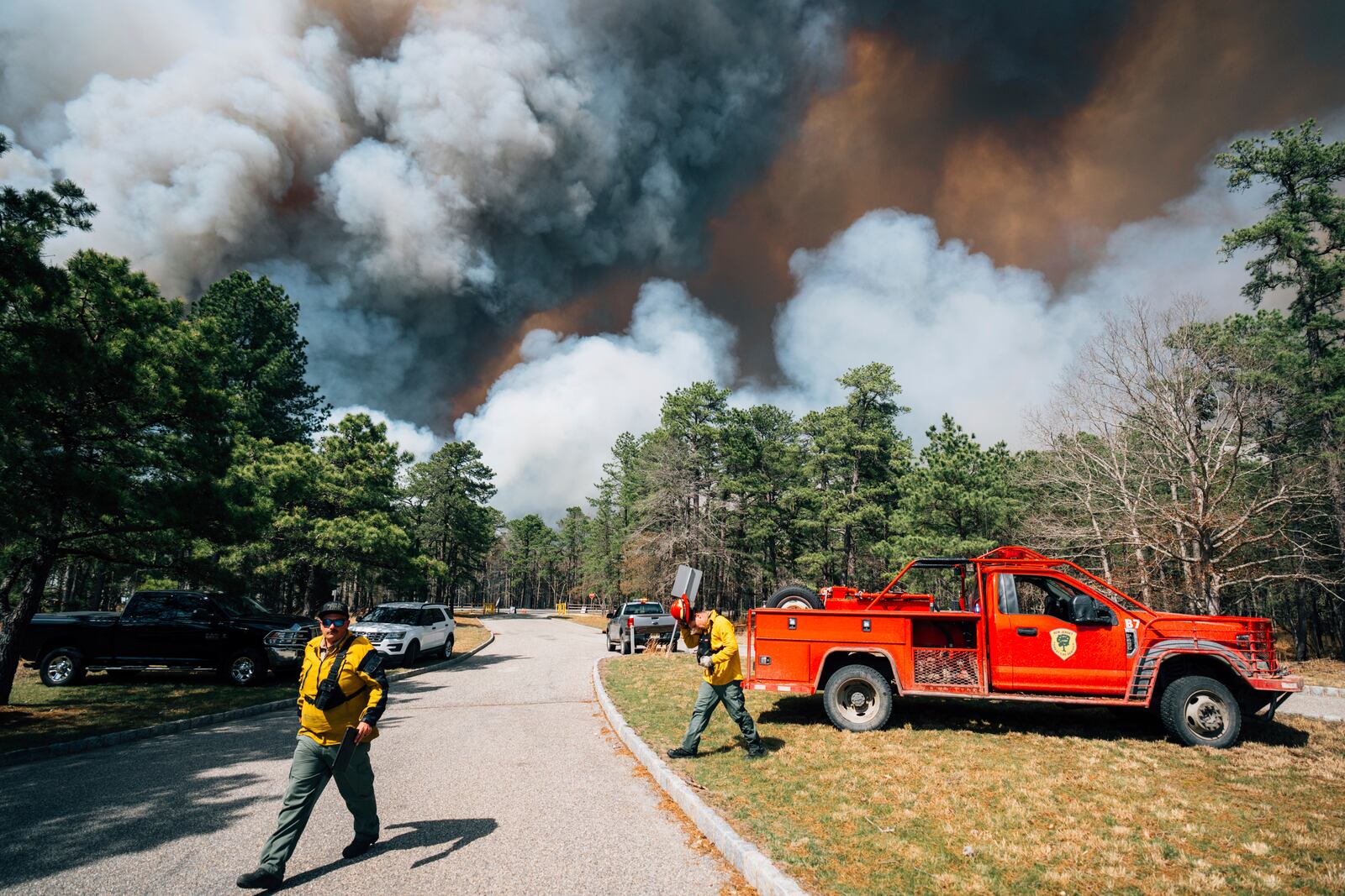 Firefighters battle a wildfire in Ocean County, N.J. on Thursday, April 24, 2025. (New Jersey Department of Environmental Protection via AP)