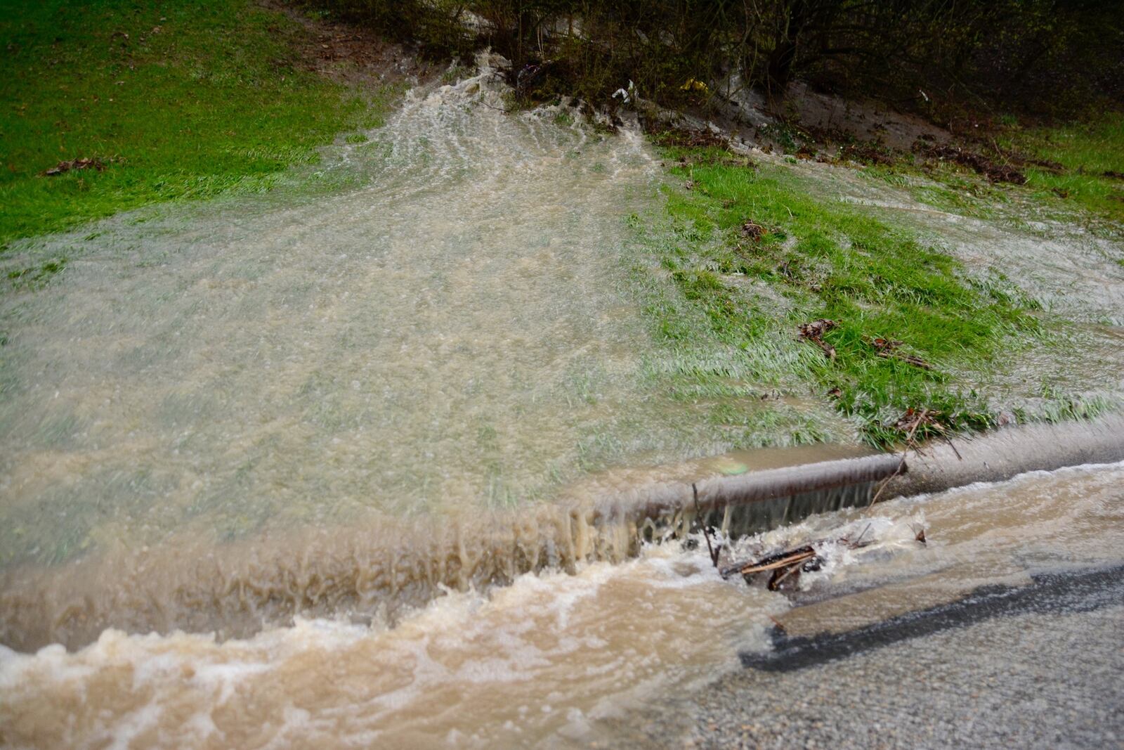 Tuesday morning, April 3, 2018, rains lead to some flooding around Butler County, including in the back yards of some homes on Evalie Drive in the city of Fairfield. 