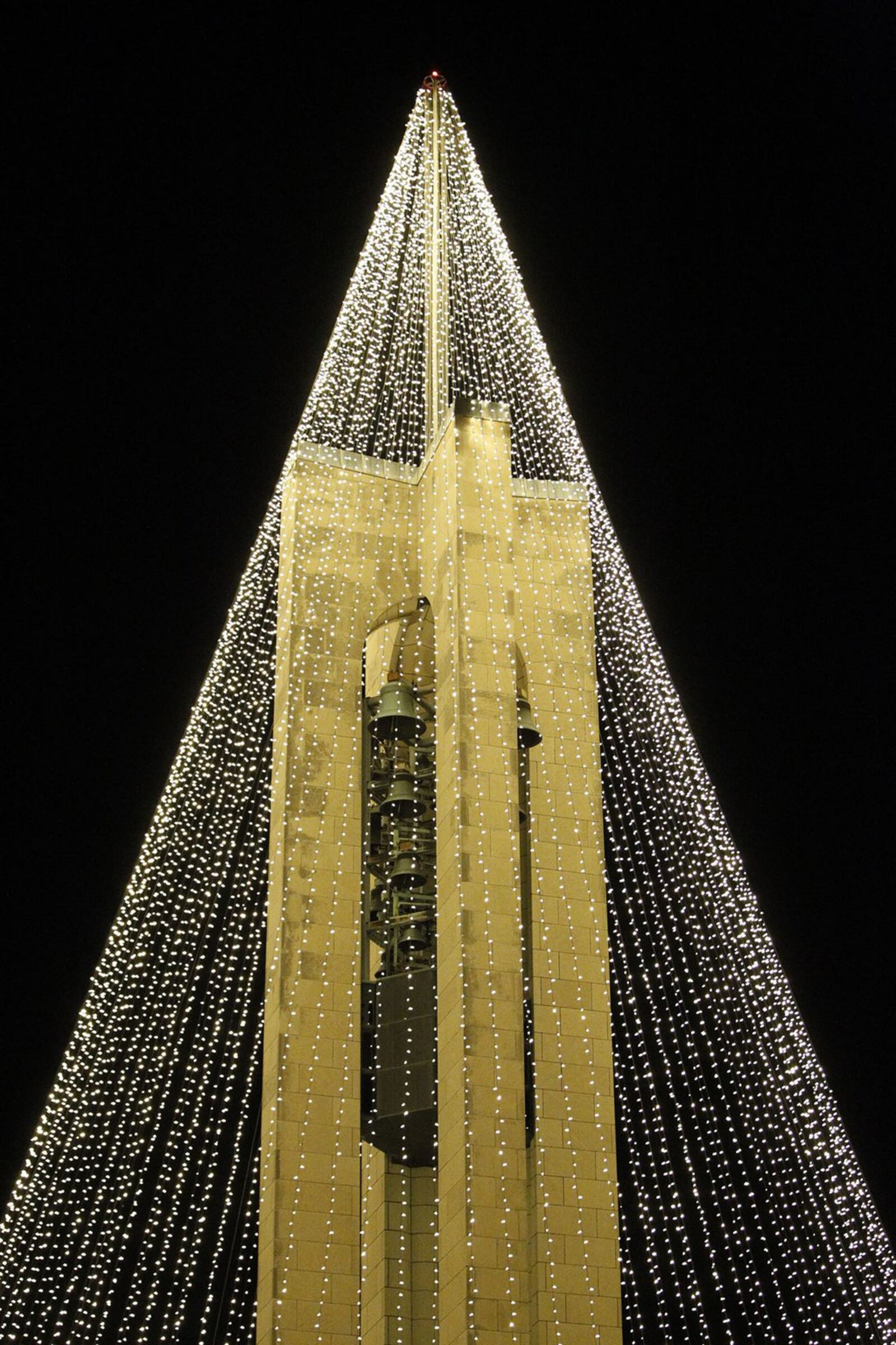 Dayton History has transformed the Deeds Carillon at Carillon Park into a huge lighted Christmas Tree. TY GREENLEES / STAFF