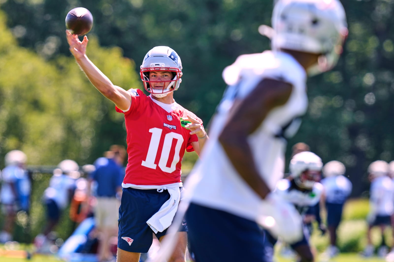 New England Patriots quarterback Drake Maye throws a pass during practice at the team's NFL football training camp, Wednesday, July 23, 2025, in Foxborough, Mass. (AP Photo/Charles Krupa)