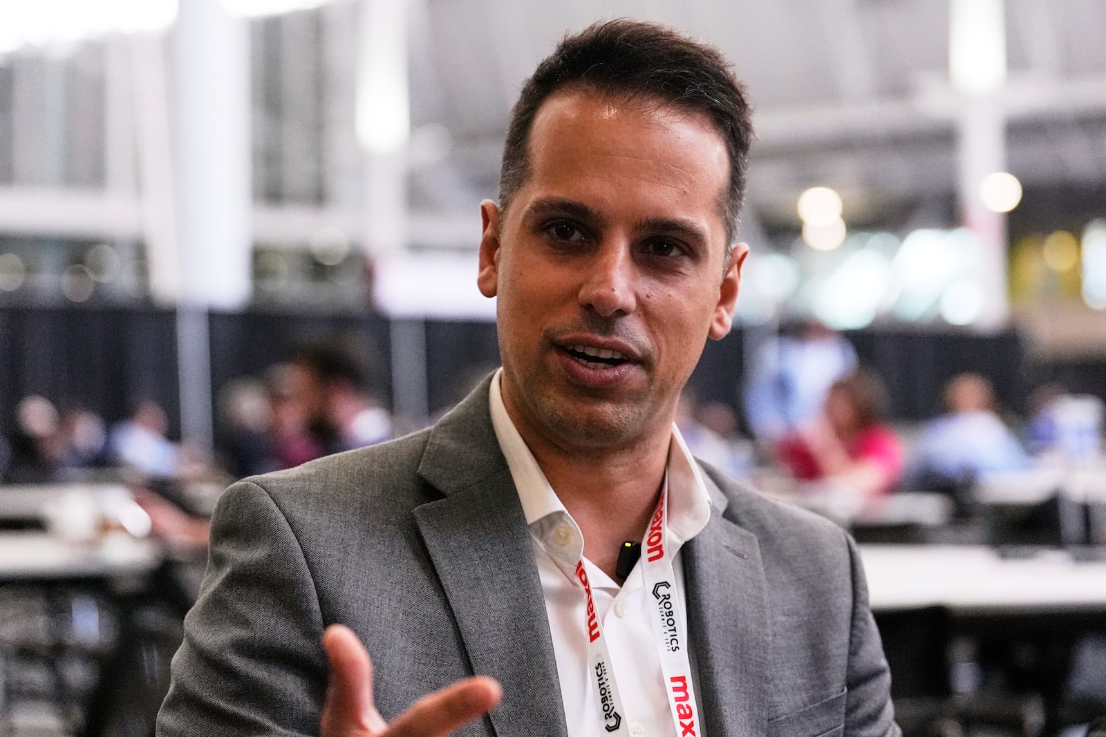 Al Makke, Director of Engineering at Schaeffler Group USA, gestures during an interview at the Robotics Summit & Expo, Wednesday, April 30, 2025, in Boston. (AP Photo/Charles Krupa)