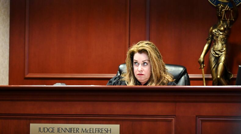 Dominick Grubb, 18, of Hamilton, was indicted last month on attempting to hire a person to kill a woman allegedly involved in another case he's involved with, an aggravated robbery from November 2024. Pictured is Butler County Common Pleas Judge Jennifer McElfresh as she listens to Grubb telling her he no longer wants to have defense attorney Arica Underwood to represent him and plans to retain a new attorney. MICHAEL D. PITMAN/STAFF