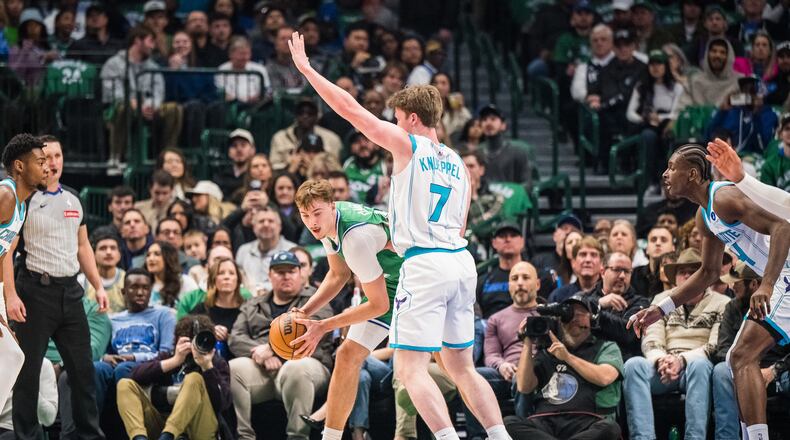 Charlotte Hornets guard Kon Knueppel (7) defends against Dallas Mavericks forward Cooper Flagg, center left, during an NBA basketball game, Thursday, Jan. 29, 2026, in Dallas. (AP Photo/Jessica Tobias)