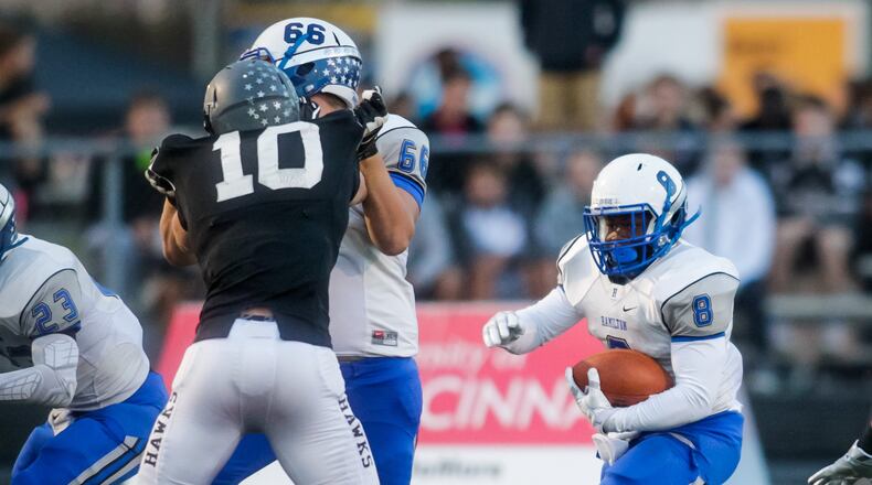 Hamilton’s Maleek Jarrett carries the ball during a game at Lakota East on Sept. 30, 2016. The host Thunderhawks won 31-28. NICK GRAHAM/STAFF