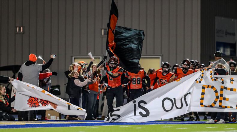 West Liberty-Salem takes the field prior to a Division V playoff game vs. Waynesville at Welcome Stadium in Dayton. Michael Cooper/CONTRIBUTED