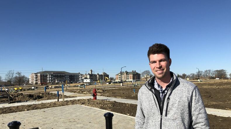 Matt Obringer, project manager for the Union Village planned community in Warren County, stands where the first neighborhood is expected to take shape over the next year. The Otterbein retirement campus stands on the other side of Ohio 741. STAFF/LAWRENCE BUDD