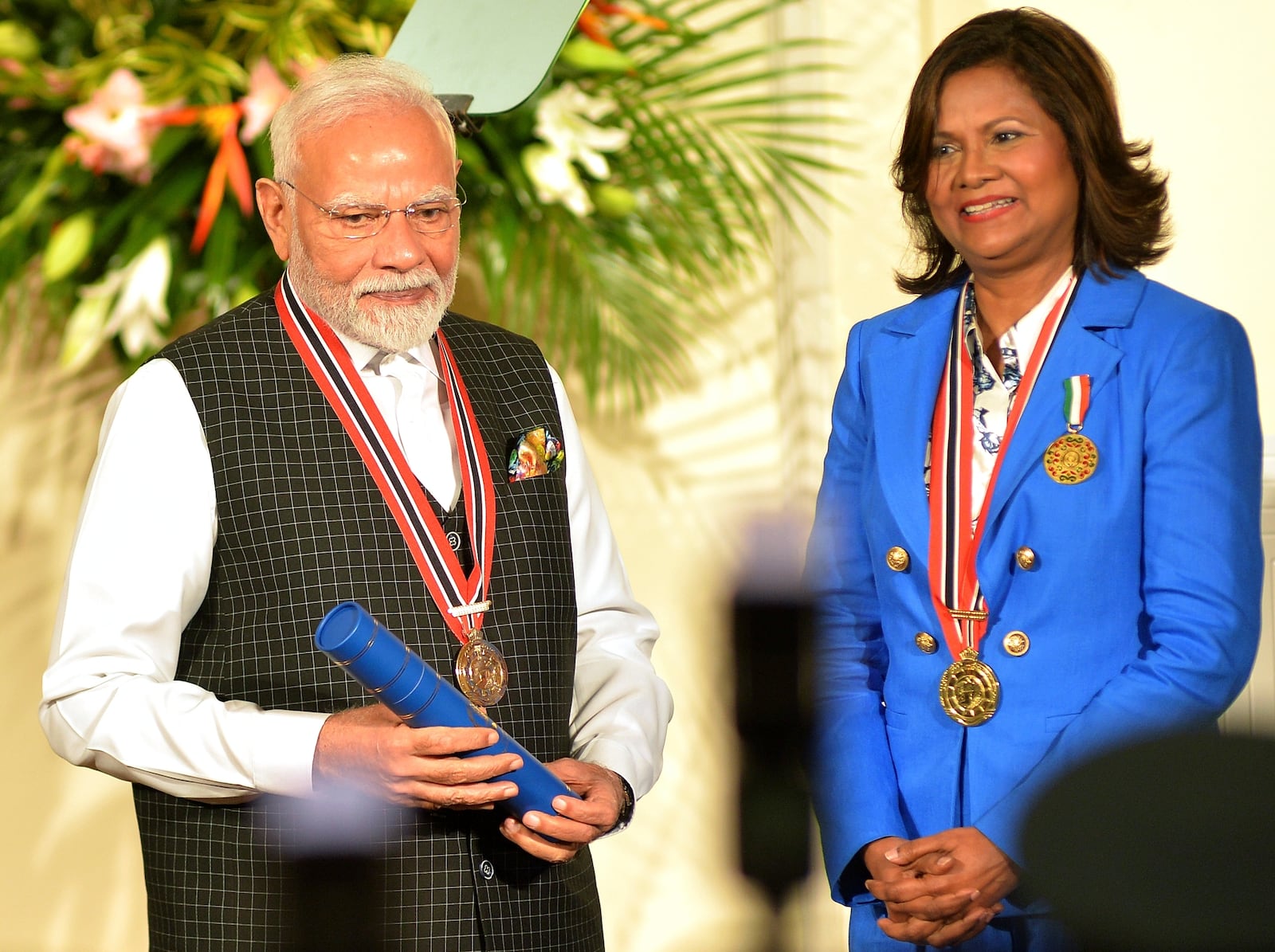India's Prime Minister Narendra Modi, left, receives the Order of the Republic of Trinidad and Tobago, the nation's highest honor, from Trinidad and Tobago President Carla Kangaloo at presidential residence in Port of Spain, Trinidad and Tobago, Friday, July 4, 2025. (AP Photo/Robert Taylor)