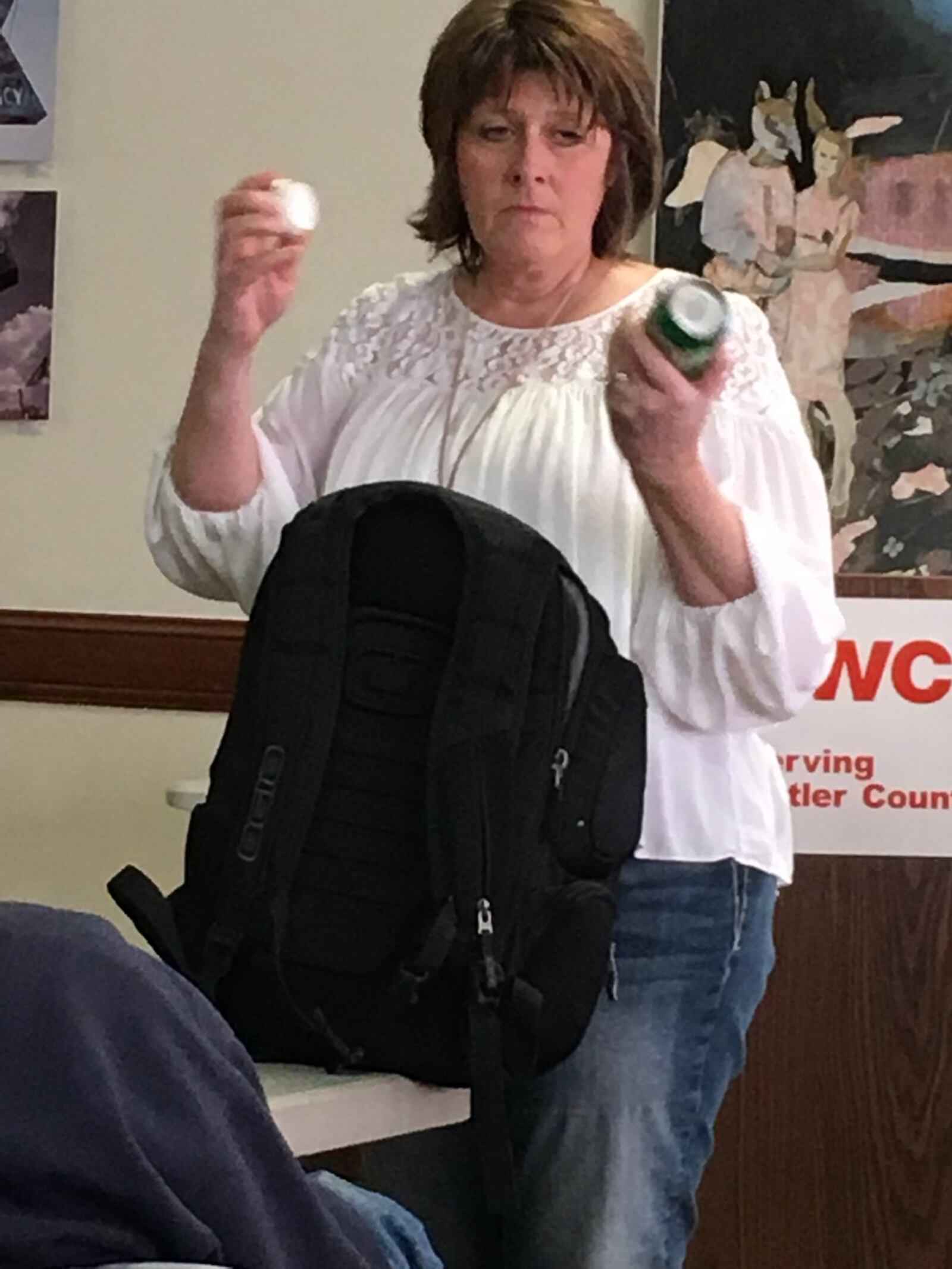 Jennifer Mason, EMT coordinator at Fort Hamilton Hospital, shows how some children can hide drugs in common household items Saturday during an event at the Hamilton YWCA. RICK MCCRABB / STAFF