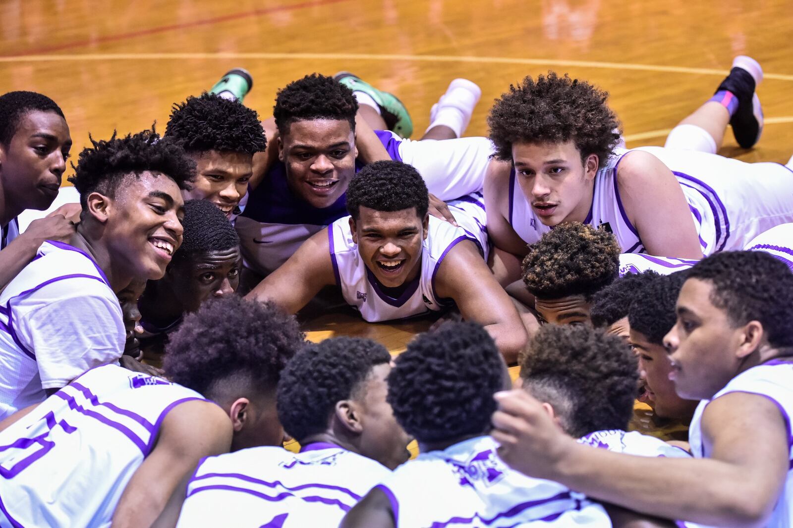 Middletown’s players gather in a circle before Friday night’s game against visiting Hamilton at Wade E. Miller Gym. NICK GRAHAM/STAFF