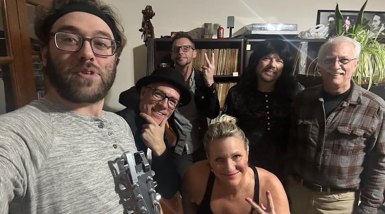 ClassX Radio acquired the WHSS 89.5 FM signal, which started out as the radio station for Hamilton High School. Spryex Communications, which broadcasts ClassX Radio, now has coverage for its classic rock format in Butler County. Pictured is Spry (right), DJ Marci Bauer (bottom center) and the local band Floyd and the Walkmen. PROVIDED