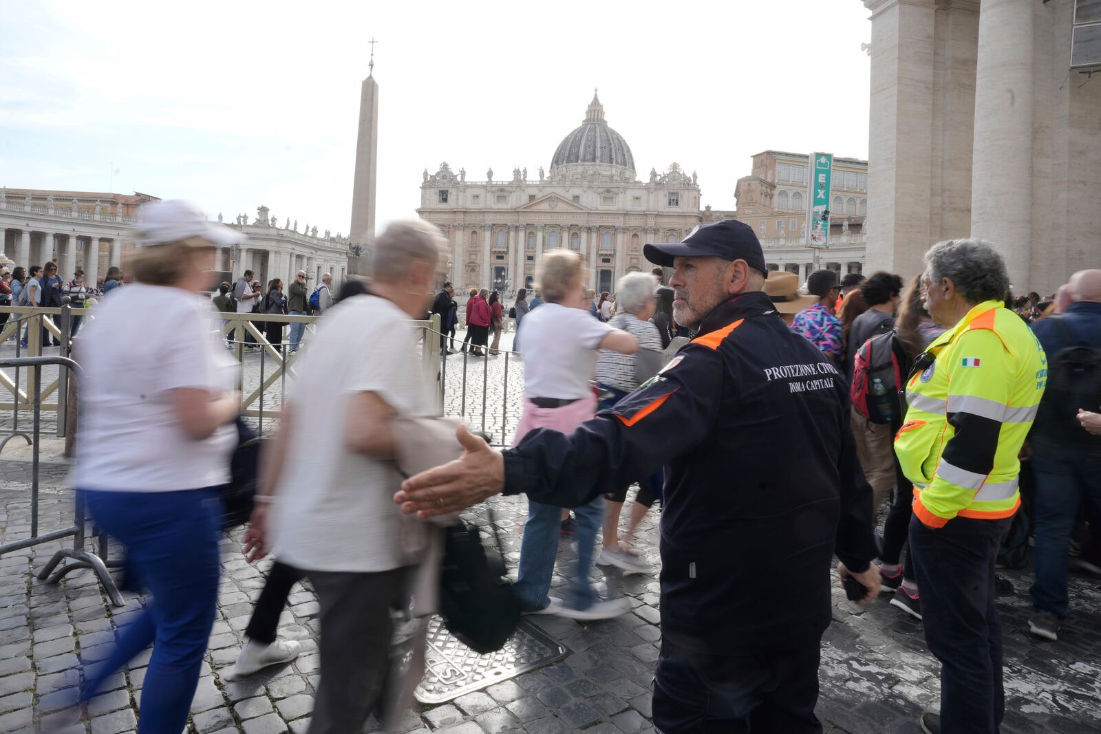 Faithful are channeled in St. Peter's Square at the Vatican, Wednesday, April 23, 2025 as the body of the late Pope Francis will lie in state inside St. Peter's Basilica for three days. (AP Photo/Markus Schreiber)