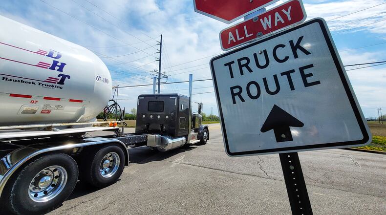 This truck driver follows the signs as he crosses over Yankee Road to Todhunter Road in Monroe. Residents say too many truck drivers disobey the signs. NICK GRAHAM/STAFF