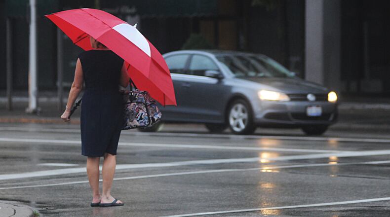 Rainy weather, Jefferson and Second streets, Dayton, Oct. 20, 2016. MARSHALL GORBY/STAFF