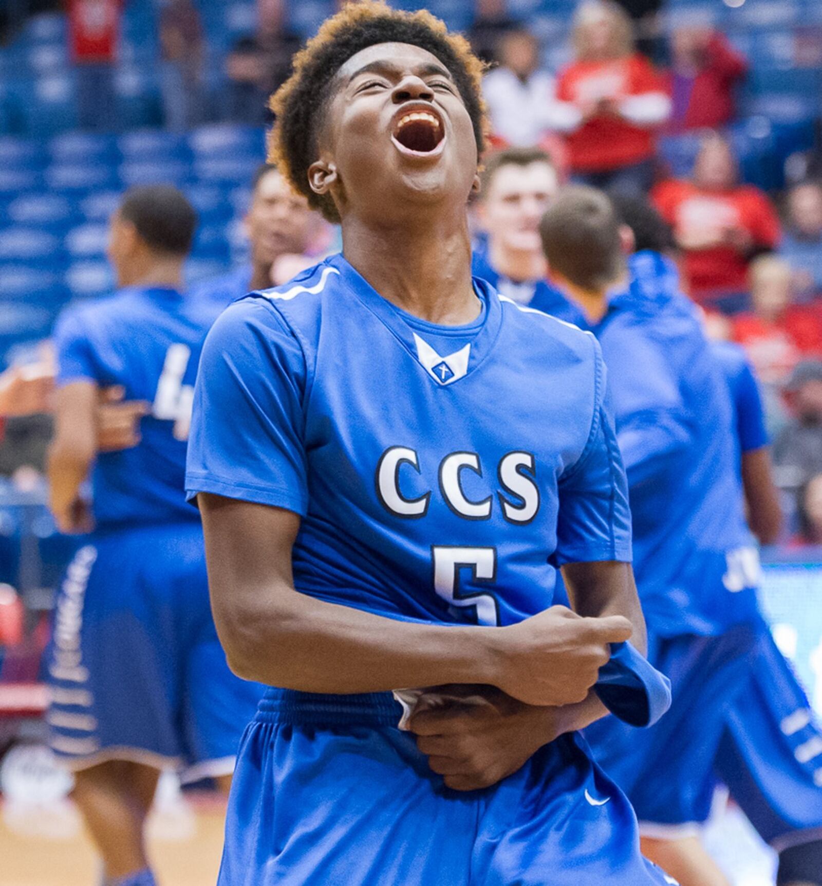 Cincinnati Christian’s Elijah Taylor shows his joy just after the Cougars defeated South Charleston Southeastern 54-52 to capture a Division IV district championship Friday night at the University of Dayton Arena. CONTRIBUTED PHOTO BY BRYANT BILLING