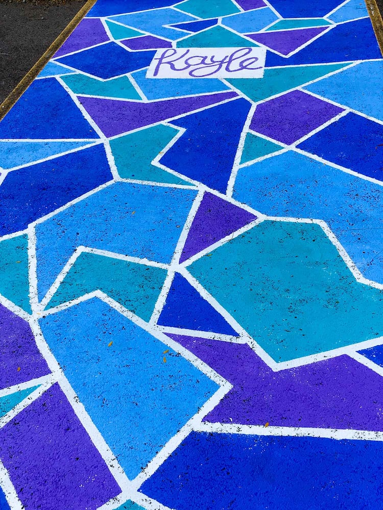 PHOTOS Lakota East seniors paint parking spots